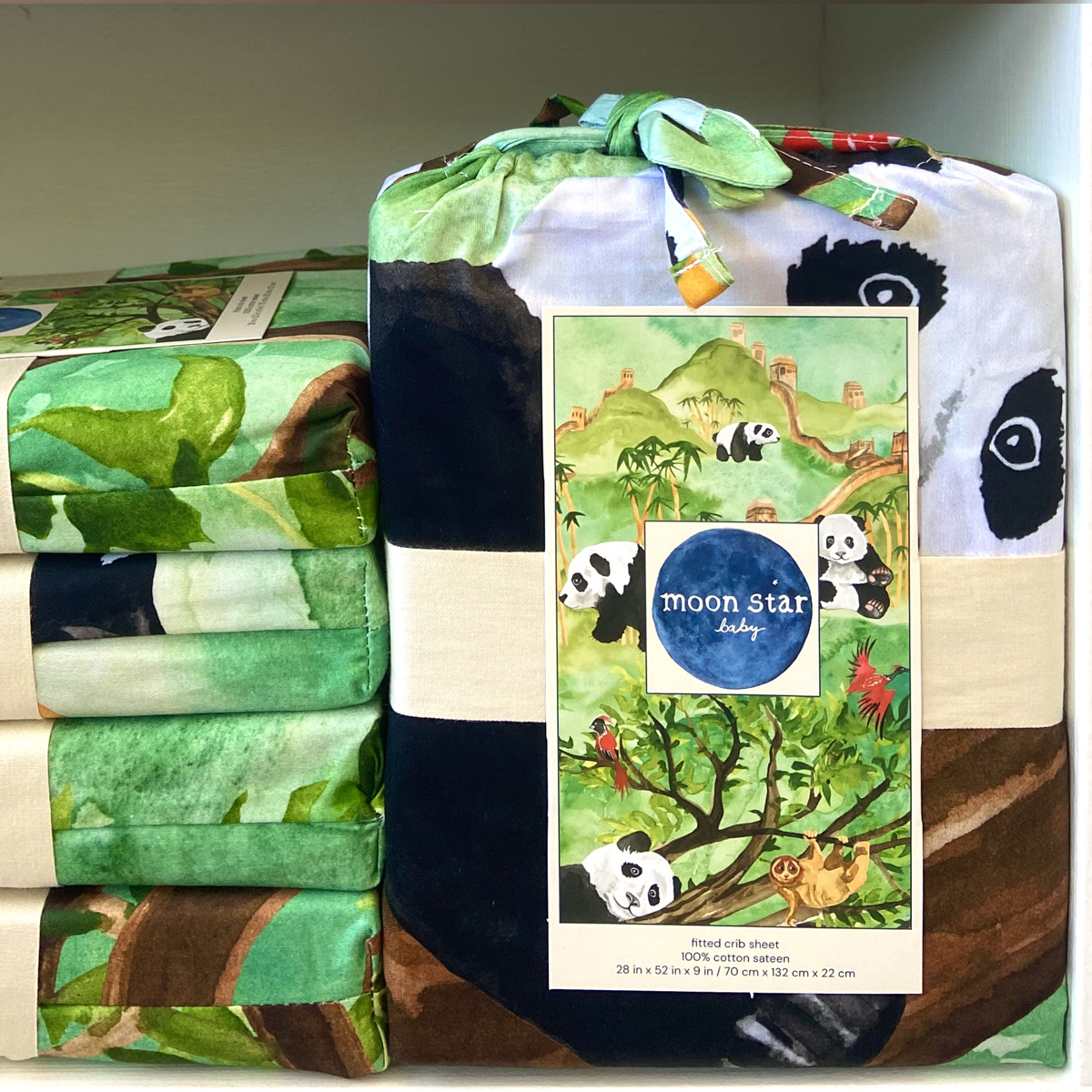 Great Cuddle of Pandas comes folded in a fabric bag made of the same fabric as the sheet so shows portions of the design. A full image of the design in shown on the label.